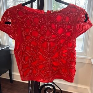 Alice and Olivia cropped embellished top.  Size 2 in Poppy Red